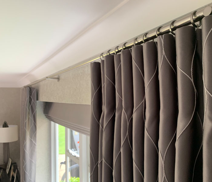 Cartridge pleat curtains with romans blinds