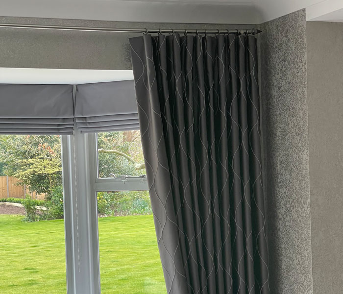 Cartridge pleat curtains with romans blinds